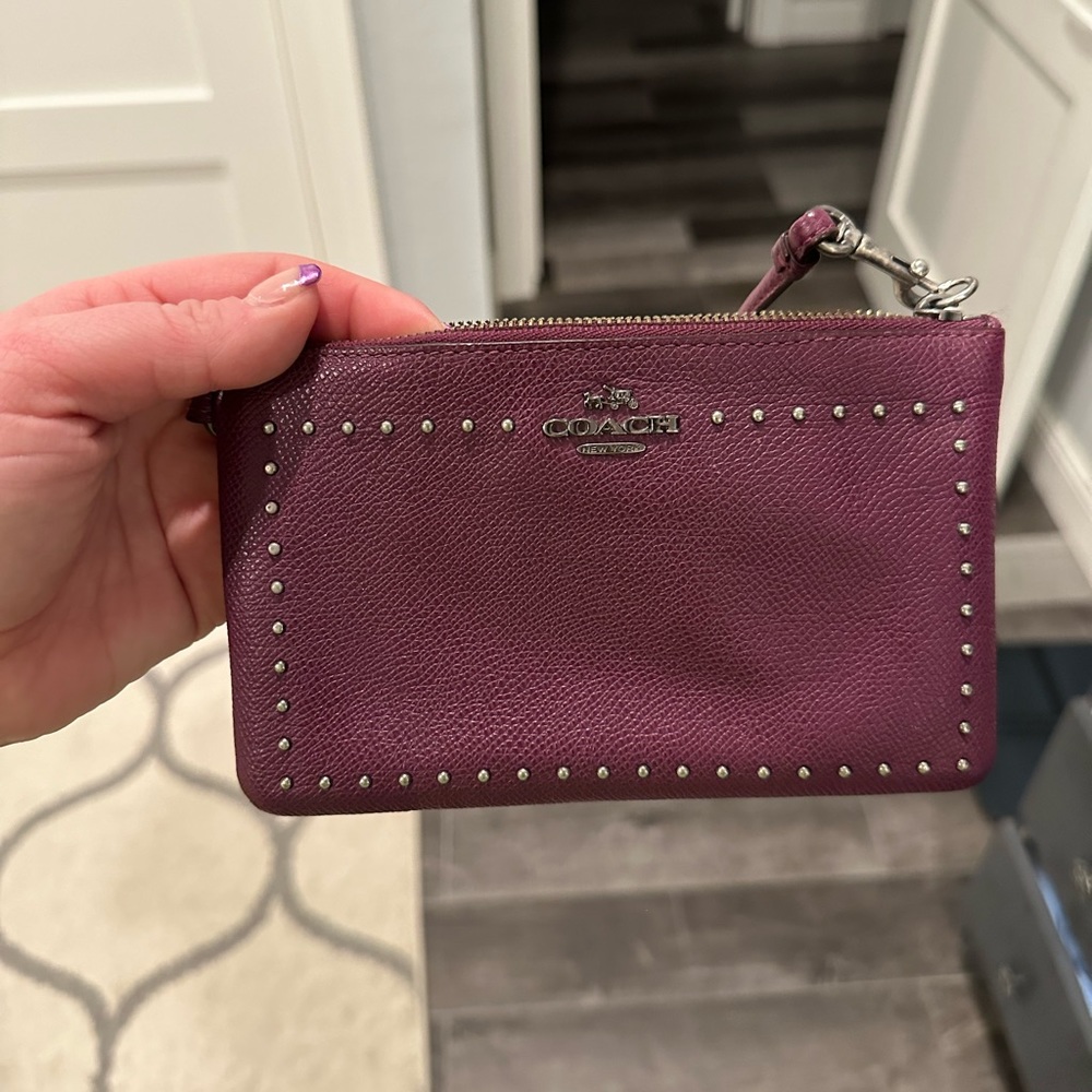 Purple studded Coach wristlet